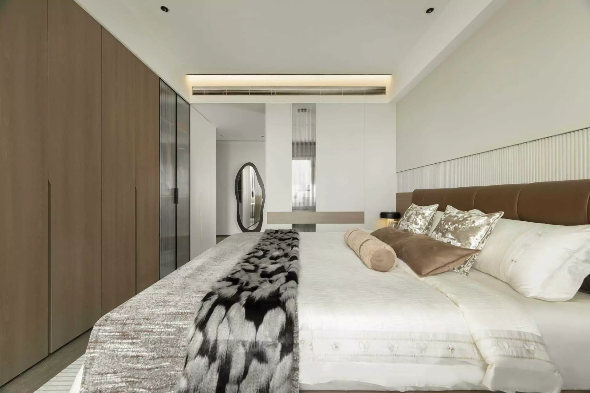 Cozy master bedroom design with integrated wooden headboard
