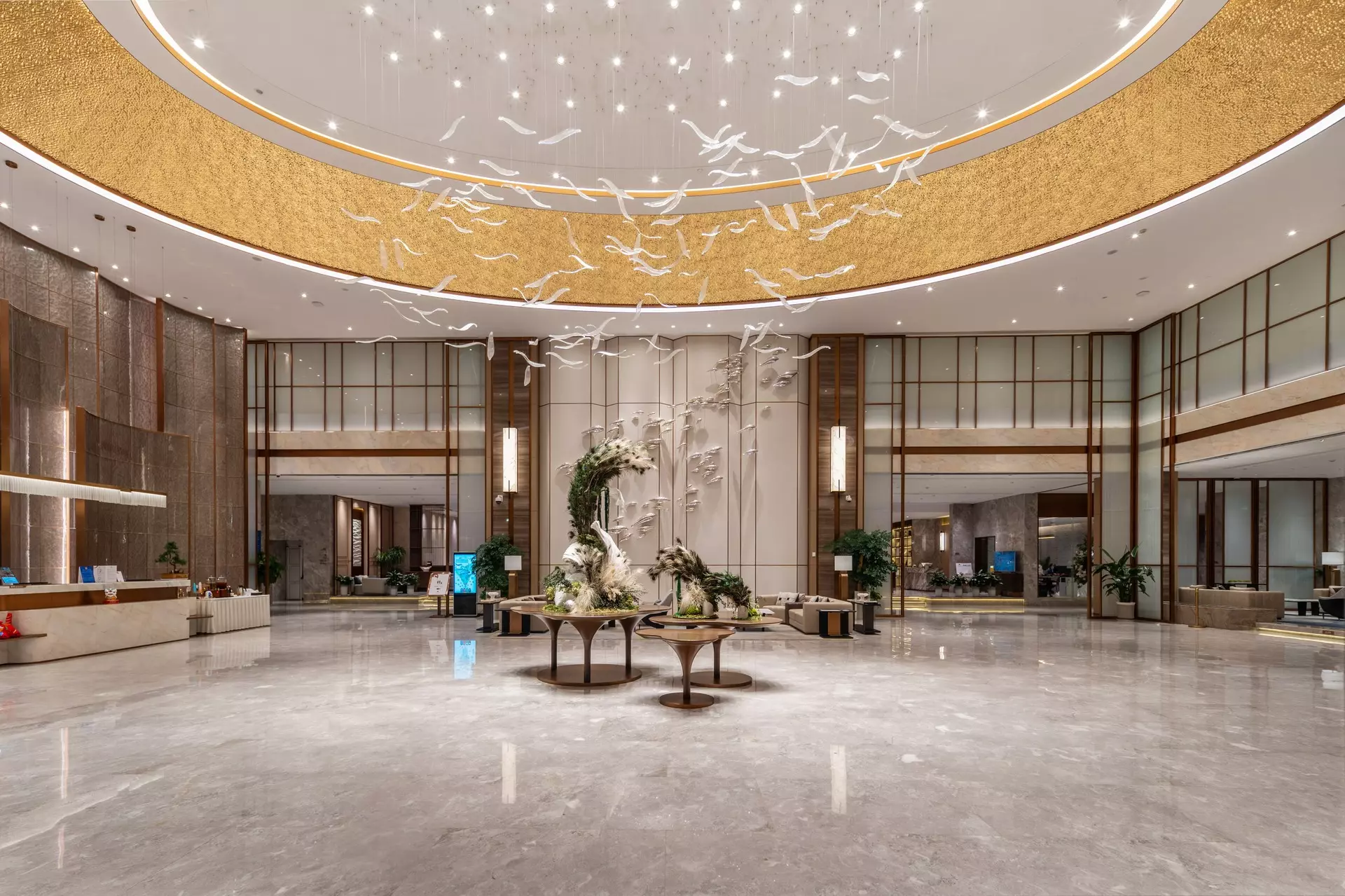 Grand lobby feature wall with custom wood paneling at White Swan Hotel Zhanjiang