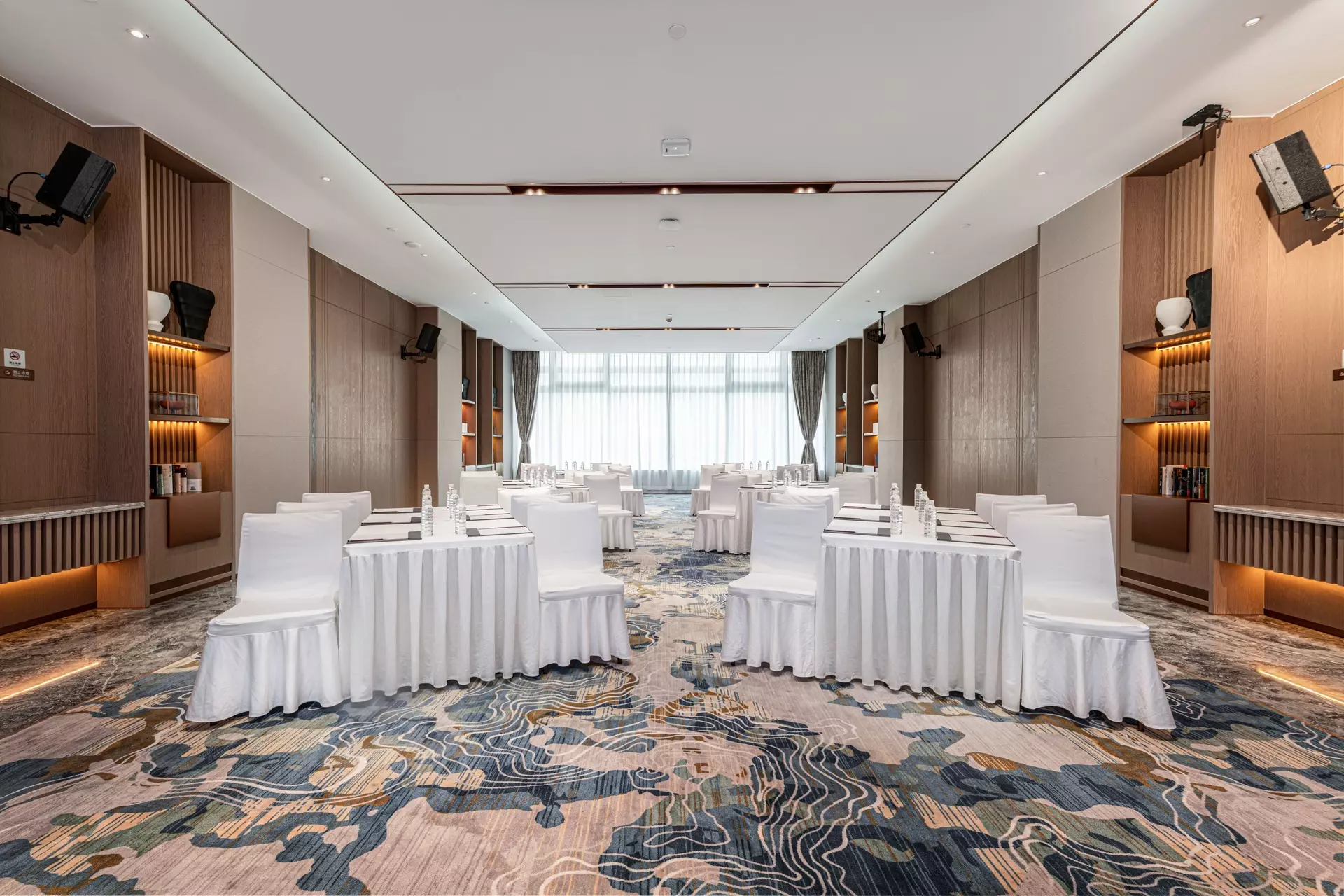 Integrated AV and media wooden wall solutions in conference hall