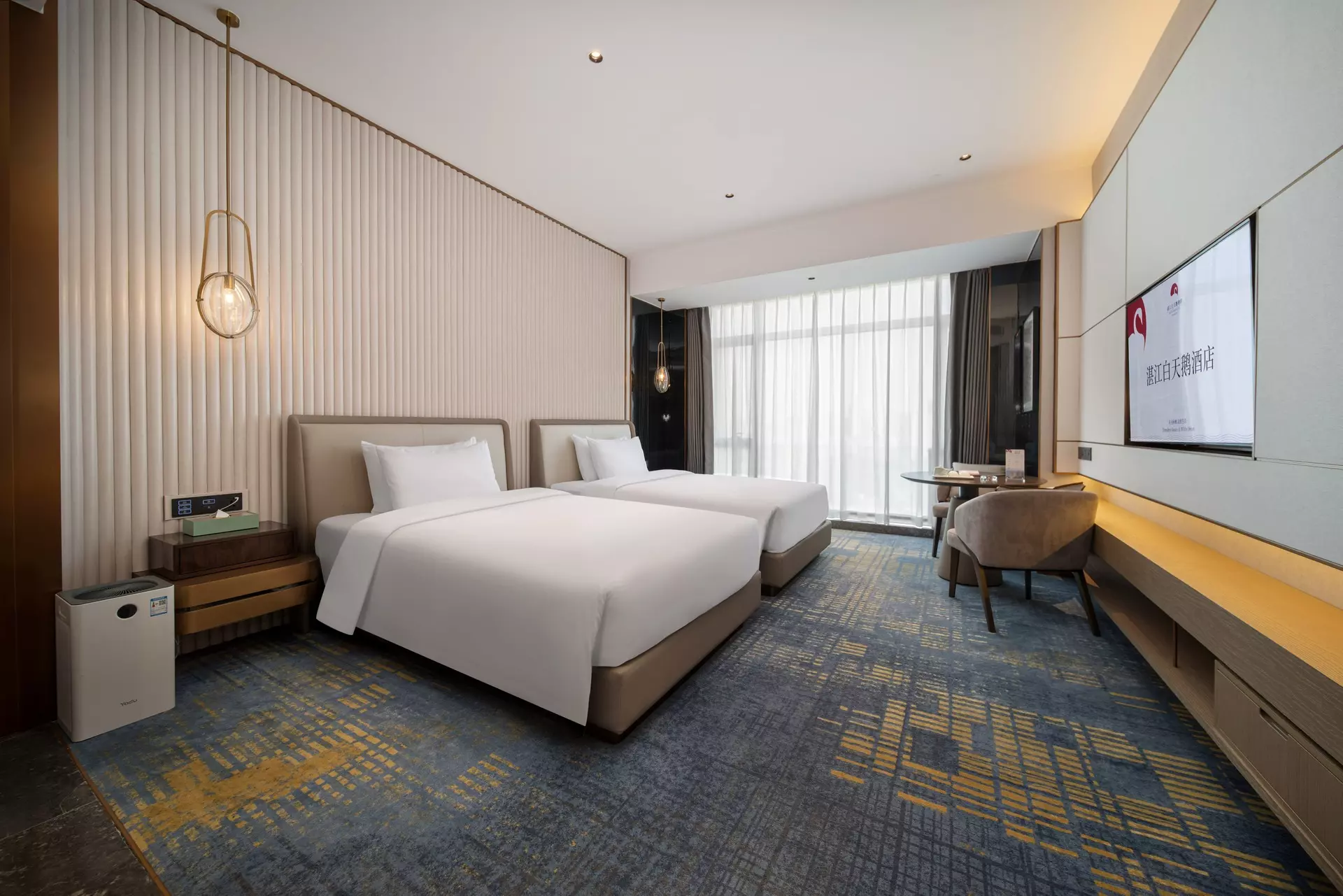 Custom hotel suite living room featuring premium whole-house wood joinery