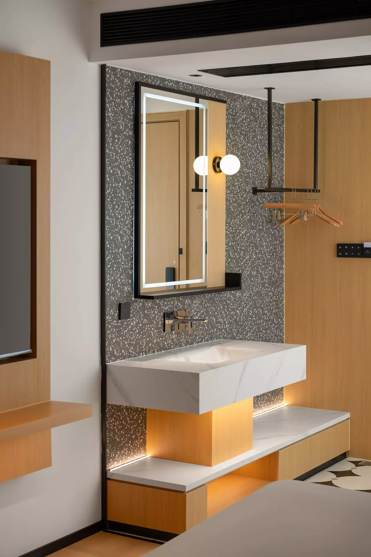 Integrated ambient downlighting and structural custom millwork columns