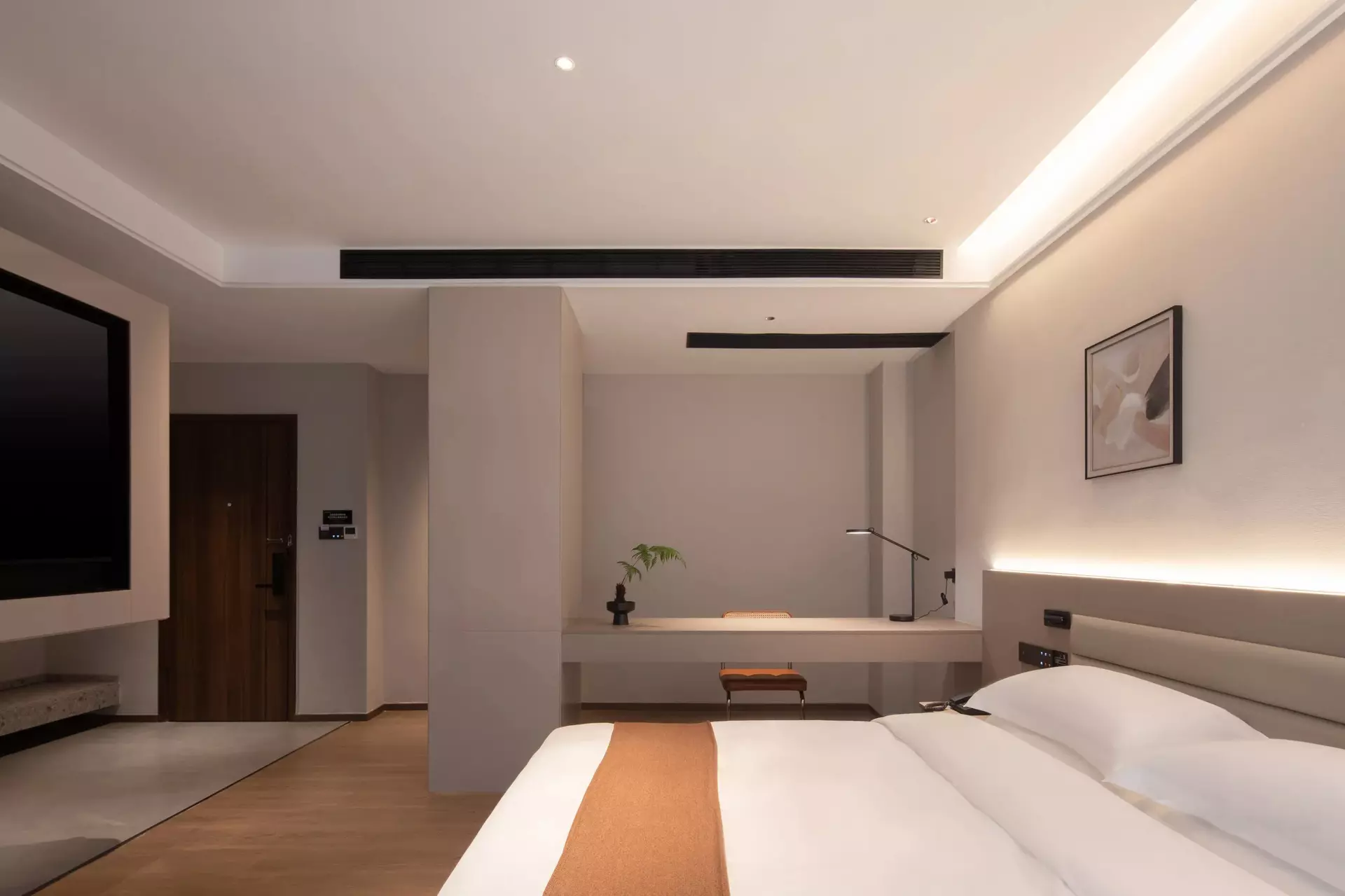 Precise joinery detail on custom wood furniture inside boutique hotel room